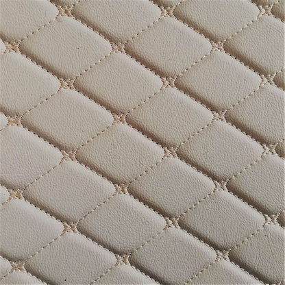 Close-up of a cream-colored diamond-stitched leather texture, ideal for car interiors and upholstery.