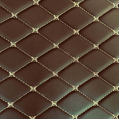 Close-up of luxurious diamond-stitched brown leather texture for car mats.