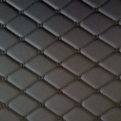 Close-up of diamond-stitched black leather texture, ideal for car interior mats and upholstery.